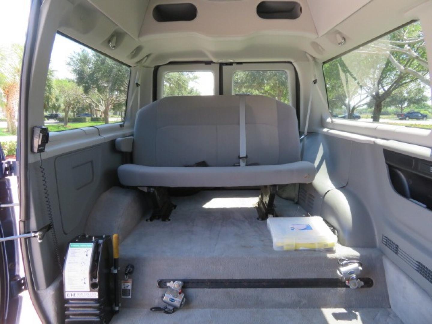 2011 Dark Blue /Gray Ford E-Series Wagon E-350 XLT Super Duty (1FBNE3BS4BD) with an 6.8L V10 SOHC 20V engine, located at 4301 Oak Circle #19, Boca Raton, FL, 33431, (954) 561-2499, 26.388861, -80.084038 - You are looking at a Gorgeous 2011 Ford Econoline E350 XLT Norcal Max High Top Handicap Wheelchair Conversion Van with 6.8L V10, 15K Original Miles, 9 Inch Lowered Floor, Braun UVL Side Entry Wheelchair Lift, Remote Control Power Side Entry Doors, Expanded Side Entry Doors, Q Straint Tie Down, Syste - Photo#82